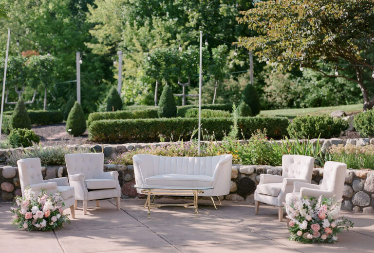 Picture of a white furniture set outside.